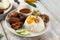 Malaysian fried chicken rice with anchovies and egg