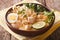 Malaysian laksa soup with chicken close up in a bowl. horizontal