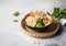 Malaysian noodles laksa soup with chicken, prawn and tofu in a bowl on grey background. copy space