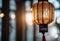 a malaysian traditional lantern called pelita with light bokeh at background