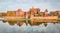 Malbork castle autumn panorama with reflection