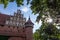 Malbork castle in Poland with fortification and turret towers in backlight with sun