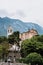 Malcesine, Italy - August 7, 2019: Oratorio Chiesa Santo Stefano Church with Monte Baldo in the background