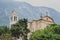 Malcesine, Italy - August 7, 2019: Oratorio Chiesa Santo Stefano Church with Monte Baldo in the background