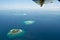 Maldives aerial panorama blue water reef