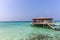 Maldives, Feb 8th 2018 - A part of the Cestara hotel over the blue water beach, calm waters in the lagoon in a clear sky in Maldiv