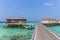 Maldives, Feb 8th 2018 - A part of the Cestara hotel over the blue water beach, calm waters in the lagoon in a clear sky in Maldiv
