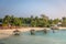 Maldives, Feb 8th 2018 - Tourists enjoying the swimming pool area and the beach area of a resort in Maldives, afternoon lights, so