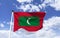 Maldives Flag Mockup, fluttering under blue sky