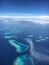 Maldives islands aerial view with clouds