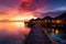 Maldives sunset at luxury water villas, a dreamy beach paradise