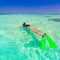 Maldives, women snorkeling