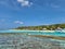 Maldivian paradise. Blue lagoon with bungalows and golden beach, palms.Kihaa maldives