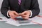 Male accountant counting money at table in office.