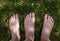 Male adult funny feet on green grass