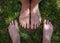 Male adult funny feet on green grass