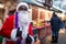 Male African-American dressed as Santa Claus at the Christmas fair