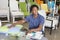 Male African American salesperson working in garden furniture store