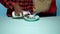 Male African caucasian woman making breakfast cereal with milk. Blue background