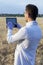 Male agronomist biologist, plant researcher farmer, Genetic scientist, Checks the growth of wheat sunrises and harvest, Cultural