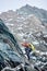 Male alpinist climbing mountain in Austria.