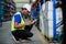 Male american african factory company employee scanning box checking number of products on goods shelves with tablet in warehouse