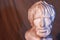 Male ancient gypsum portrait bust dark contrast