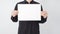 Male asian hold blank paper and wear black shirt on white background
