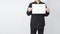 Male asian hold blank paper and wear black shirt on white background