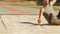 Male athlet makes a long jump at the stadium