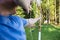 Male Athlete Aiming Arrow At Target Board In Forest