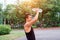 Male athlete Asian male cooling down by pouring water on top of his face after exercie