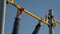 Male athlete doing exercise on horizontal bar outdoors