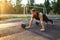 Male athlete doing push-ups outdoors, bodyweight athlete training