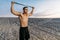 Male athlete, fit cross workout in desert