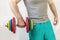 Male athlete lifting a heavy dumbbell with one hand. Home Workouts During the Coronavirus Pandemic: A Healthy Lifestyle Concept
