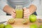 Male athlete making juice or smoothie in kitchen