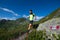 Male athlete practicing mountain running on a trail downhill