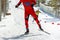 male athlete skier running skiing uphill at ski stadium