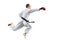 Male athlete strikes with a hand jumping against a white background