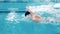 Male athlete swimming in a pool using a butterfly technique