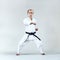 Male athlete trains formal karate exercise