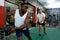 Male athletics exercising with exercise ball in fitness center