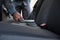 Male auto service staff cleaning a car with brush