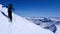 Male backcountry skier going up a snow slope in the backcountry of the Swiss Alps on a ski tour in winter