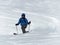 Male backcountry skier telemark skiing in the Alps in fresh powder