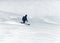 Male backcountry skier telemark skiing in the Alps in fresh powder