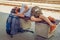 Male backpacker tourist napping on a bench