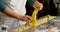 Male baker preparing pasta in bakery shop 4k