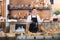 Male bakery employee offering bread and pastry